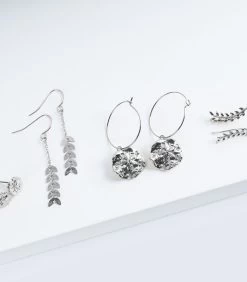 Geurkaars Kokosnoot Met Zilveren Oorbellen -Woninginrichting 26a7ce70540641e3beb51df666004979